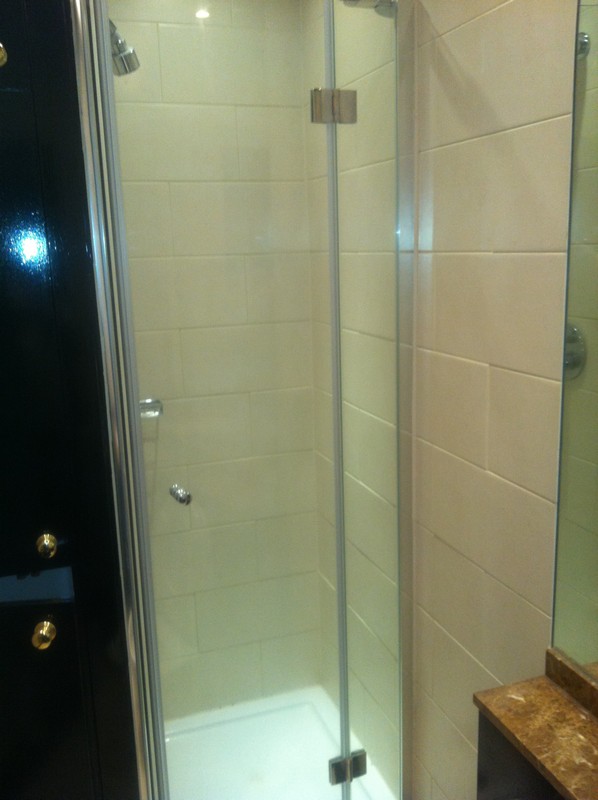Frameless glass shower enclosure with chrome fittings in Brent Cross