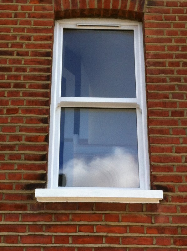 uPVC sash window on Victorian red brick house in Brent Cross
